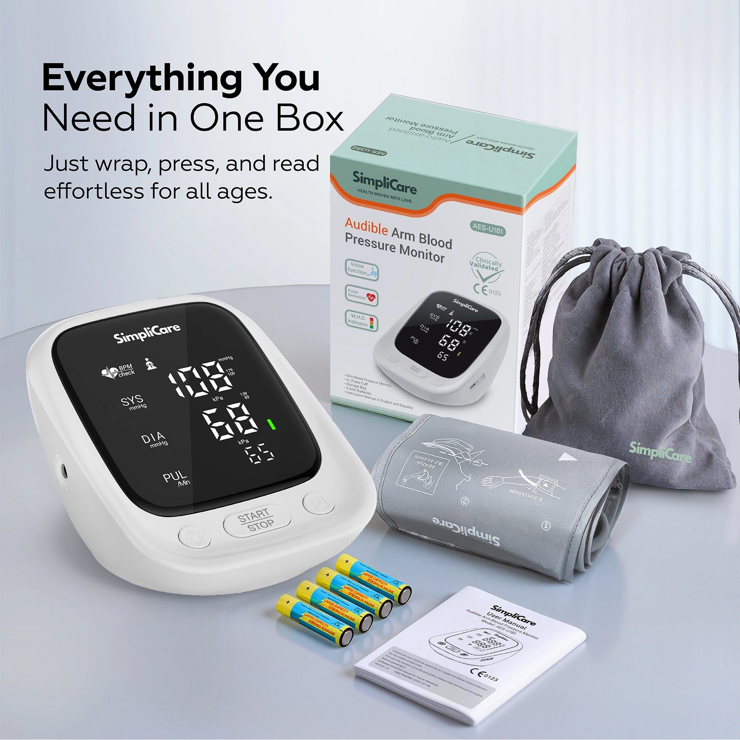 SimpliCare blood pressure monitor set with packaging, cuff, and batteries on a light gray background.