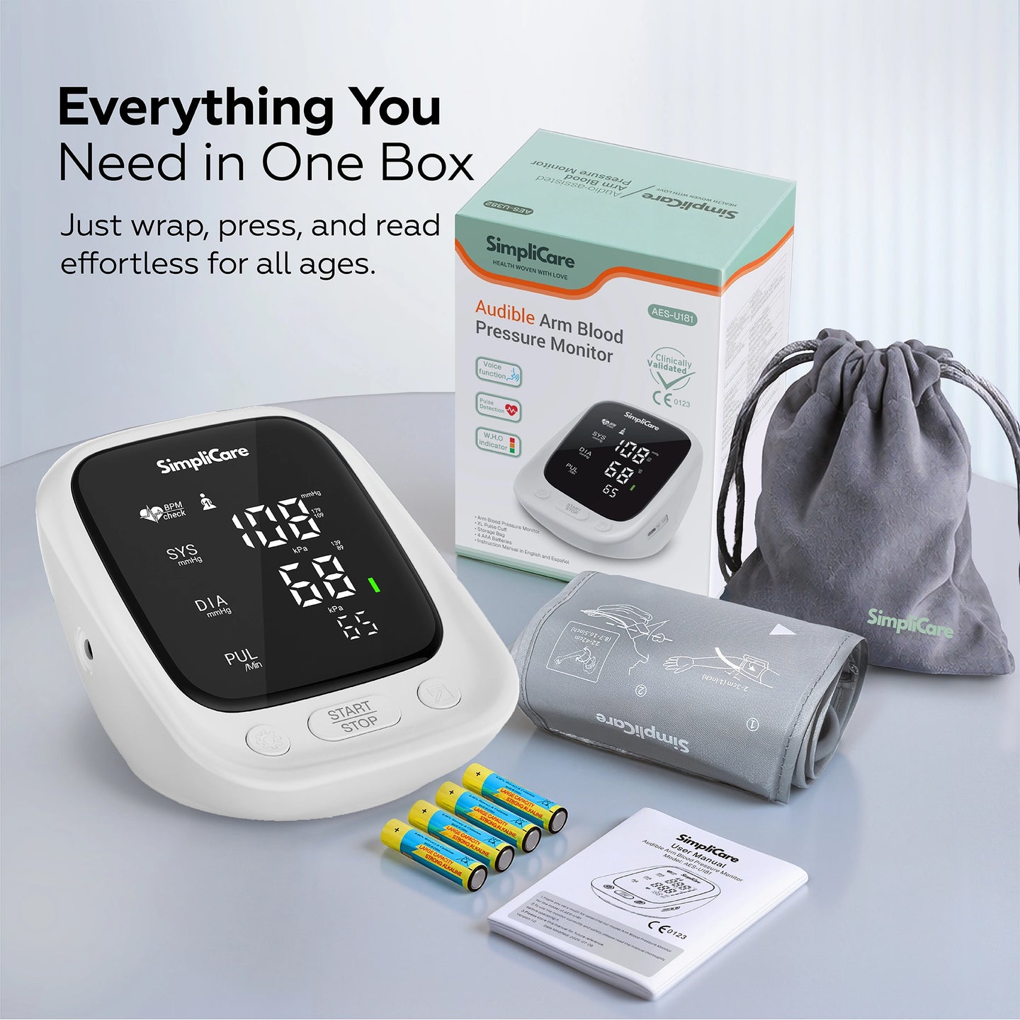SimpliCare blood pressure monitor set with packaging, cuff, and batteries on a light gray background.