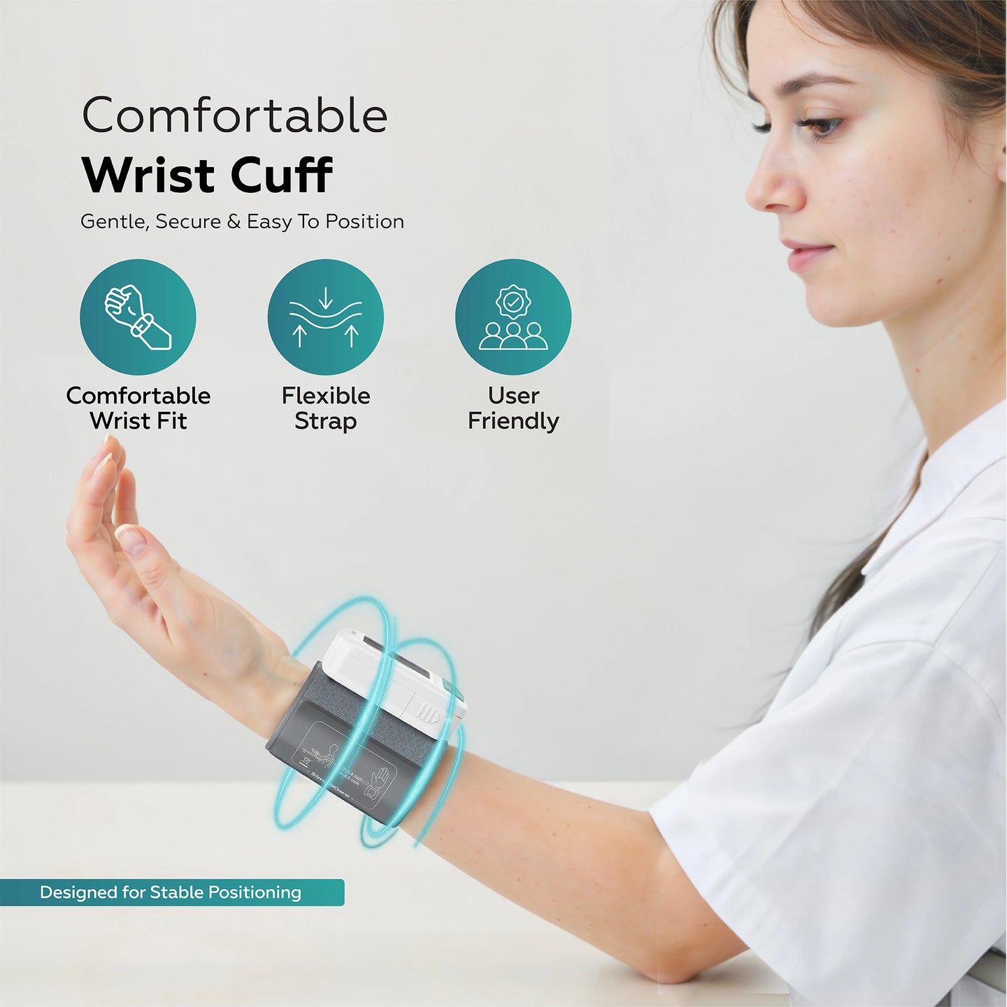 Woman wearing a wrist cuff with text highlighting features on a light background