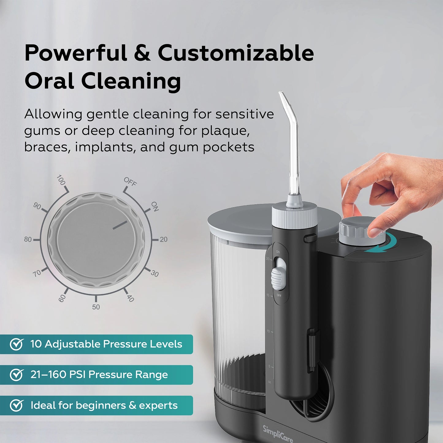 Black dental water flosser with adjustable pressure settings on a gray background